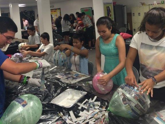 Children creating arts and crafts in HCC's through Children & Family Support Services